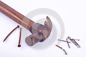 old Traditional curved claw hammer and rust nail tack used on white background tool isolated