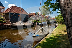 View of old canals with boats in an old Dutch town.