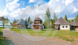 Old traditional houses and wooden belfry of village Pribylina in Liptov region SLOVAKIA - PANORAMA