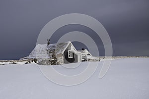 Old traditional Icelandic fishermans cottage during wintertime.