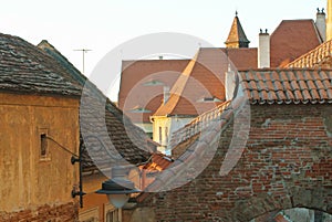 Old traditional romanian vintage orange brown houses with dormer