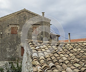 Old traditional stone house and roof in Village Krini, corfu, greece, vintage look