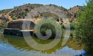 Old traditional watermills in the Guadiana river at Azenhas. Mertola. Portugal photo