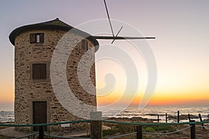 Old traditional wind-mills in sand-hills of Apulia Portugal