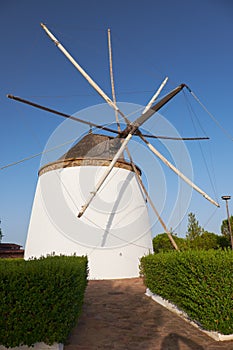 Old traditional windmill on the hill near El Granado in Andalusia, Spain photo