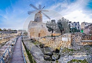 Old traditional windmill in Malta. Now an important tourist attraction. Abandoned structure.