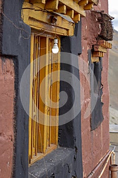 An old traditional window in a Tibetan house in the Himalayan mountains.