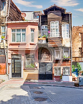 Old traditional wooden and stone houses in old Balat district, on a summer day, Istanbul, Turkey