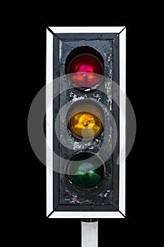Old traffic light, isolated on black background