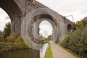 Old train bridge made of red bricks masonry