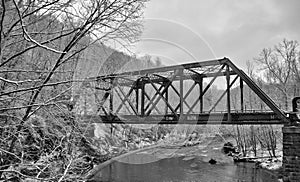 Old train bridge in snow