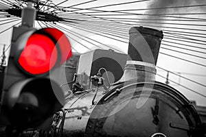 Old train with red traffic light black and white image