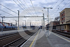 Old train station, rails wires, peron, concrete. Czech Republic