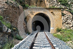 Old train tunnel with railway