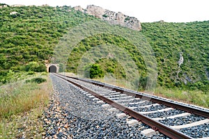 Old train tunnel with railway