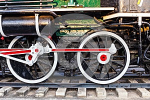 Old train wheels on rails in black