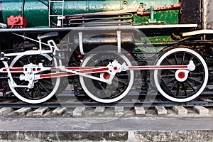 Old train wheels on rails in black