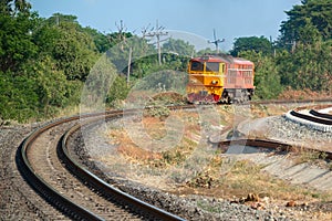 Old Train Yellow and Orange Diesel Electric locomotives on the tracks of Thailand