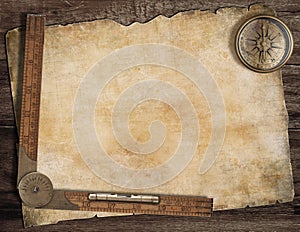 Old treasure map background with compass and ruler