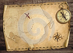 Old treasure pirates` map with compass on wood table. 3d illustration.