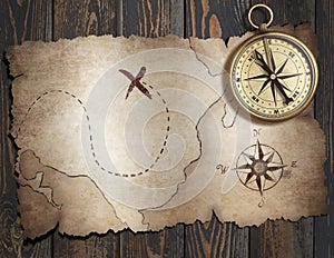 Old treasure pirates` map with compass on wood table. 3d illustration.