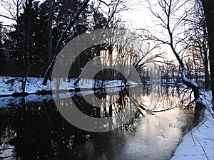 River Sysa and trees in winter in sunset time, Lithuania