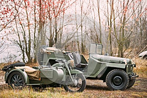 Old Tricar, Three-Wheeled Gray Motorcycle With A Sidecar Of German Forces and Willys Mb jeep, U.s. Army Truck, 4x4