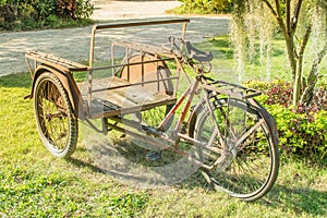 Old tricycle Parked on the lawn