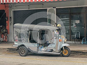 Old tricycle waiting to transport passengers in Thailand