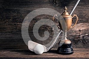 Old trophy with golf club