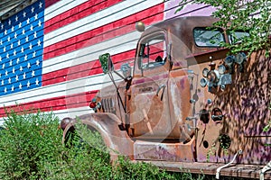 Old truck and american flag, symbol of US Route 66