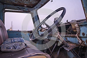 Old truck parked in rice fields in Thailand