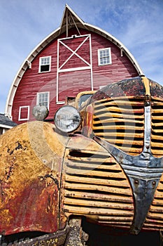 Old truck and red barn.