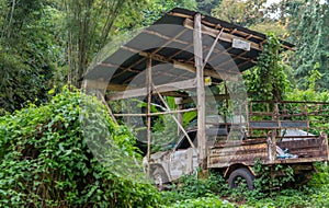 Old truck under wooden shelter - Views between Mae Hong Son and Ban Rak Thai