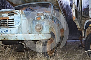 Old trucks dilapitated with rust and damaged