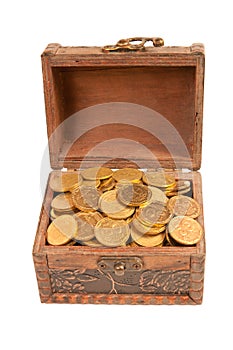 An old trunk with shiny coins isolated