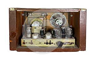 Old tubes and electric parts of an old dusty amplifier