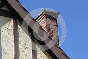 Old Tudor Style Wall and Roofline with Brick Chimney