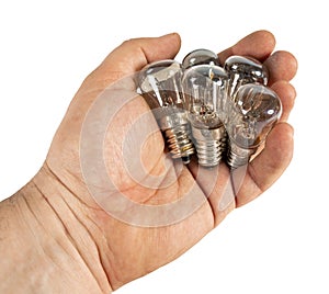 Old tungsten incandescent lamp in hand. Isolated a white background