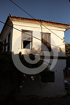 Old Turkish wooden windows in old village house. Vintage. Vertical photo.