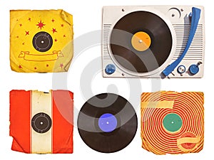 Old turntable player with record albums isolated on white