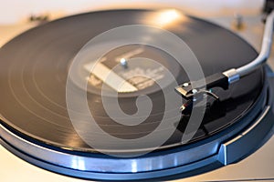 An old turntable plays your song