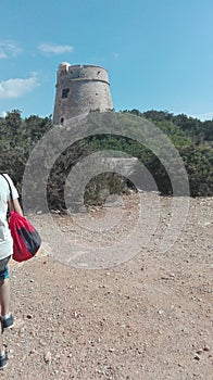 Old turrets built on high promontories on the sea to spot pirates and other boats and ships on the coast of ibiza