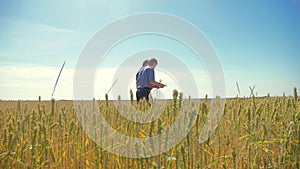 Old two farmers summer man Wheat Field running in the field wheat bread. slow motion video. farmer ecology concept