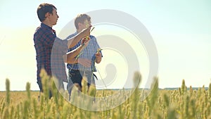 Old two farmers summer man Wheat Field running in the field wheat bread. slow motion video. farmer ecology concept