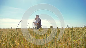 Old two farmers summer man Wheat Field running in the field wheat bread. slow motion video. farmer ecology concept