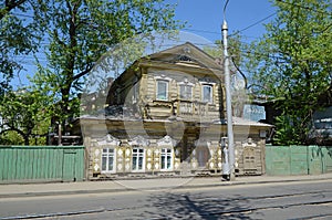 Old two-storey wooden house with a mezzanine in the center of Irkutsk