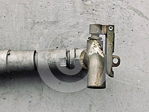 Old type Stainless steel faucet on cement wall