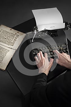 Old typewriter and an ancient manuscript