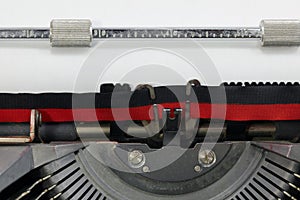 Old typewriter with black and red ink ribbon